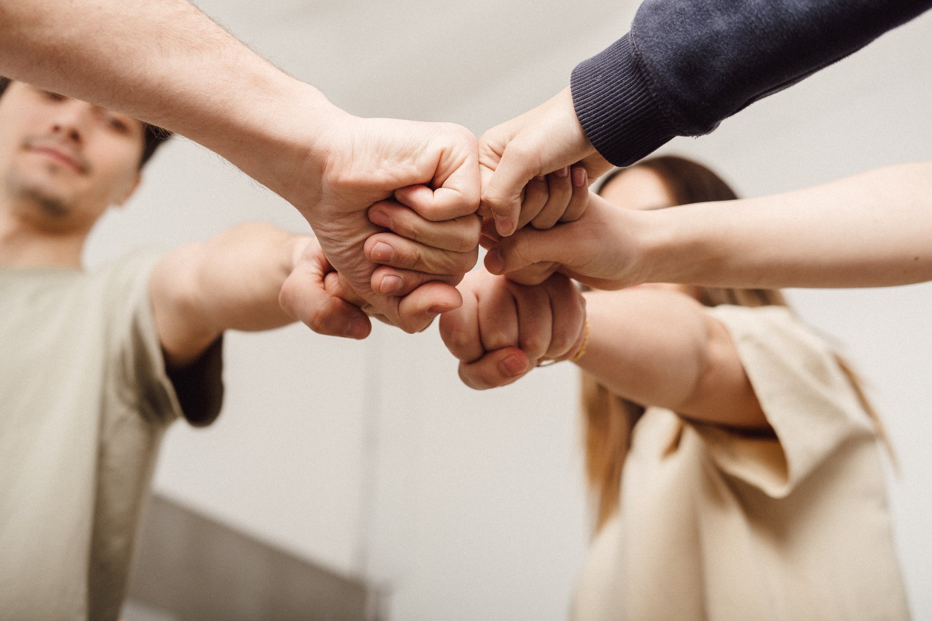 People Fist Bumping